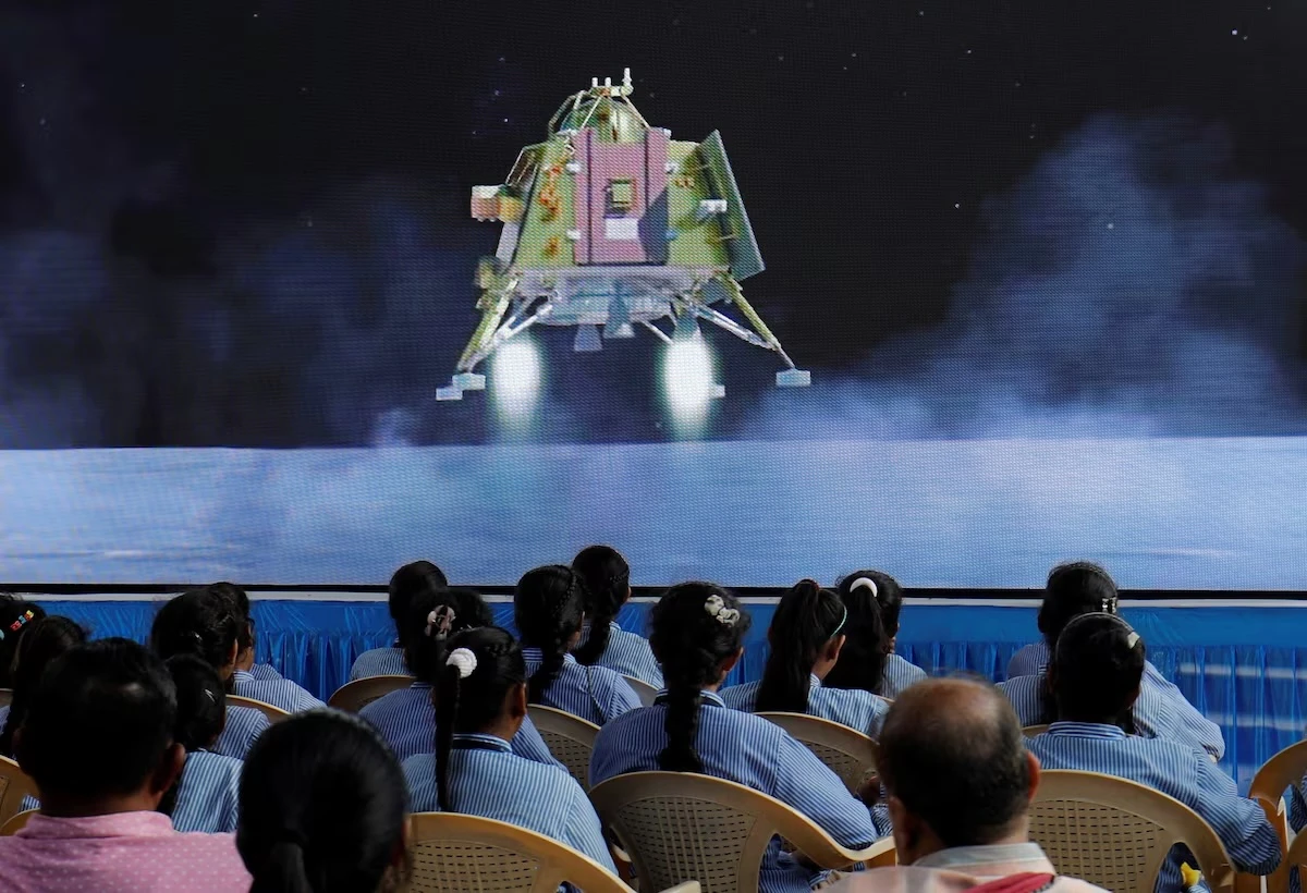 People watch a live stream of Chandrayaan-3 spacecraft's landing on the moon, inside an auditorium of Gujarat Science City in Ahmedabad, India, Aug. 23, 2023. (Reuters/File)