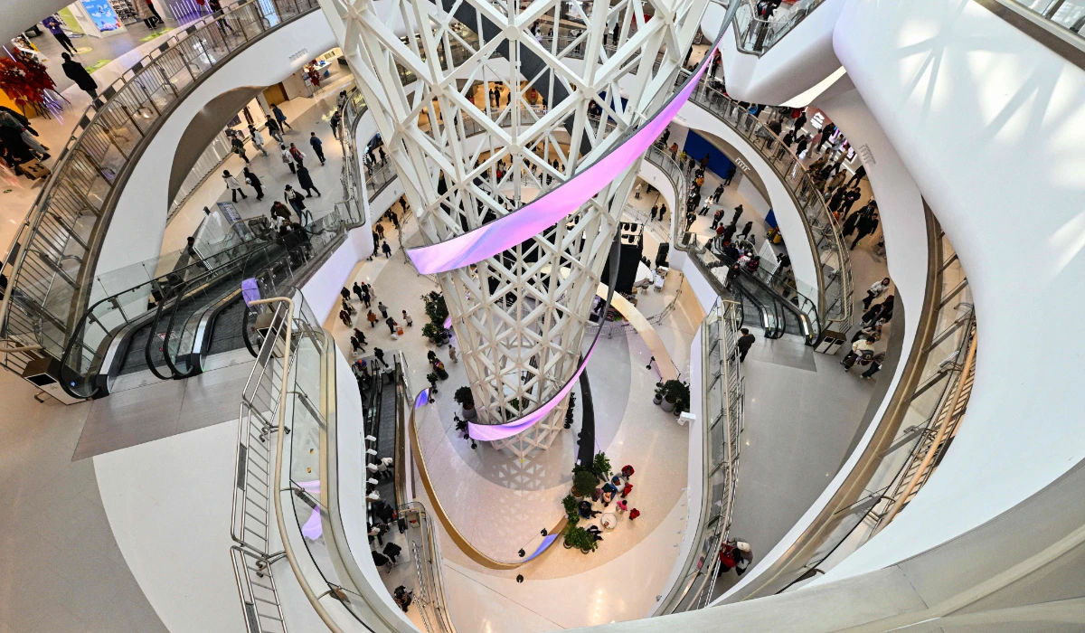 People visit a new shopping mall at the Tongzhou district of Beijing on December 26, 2025. (AFP)