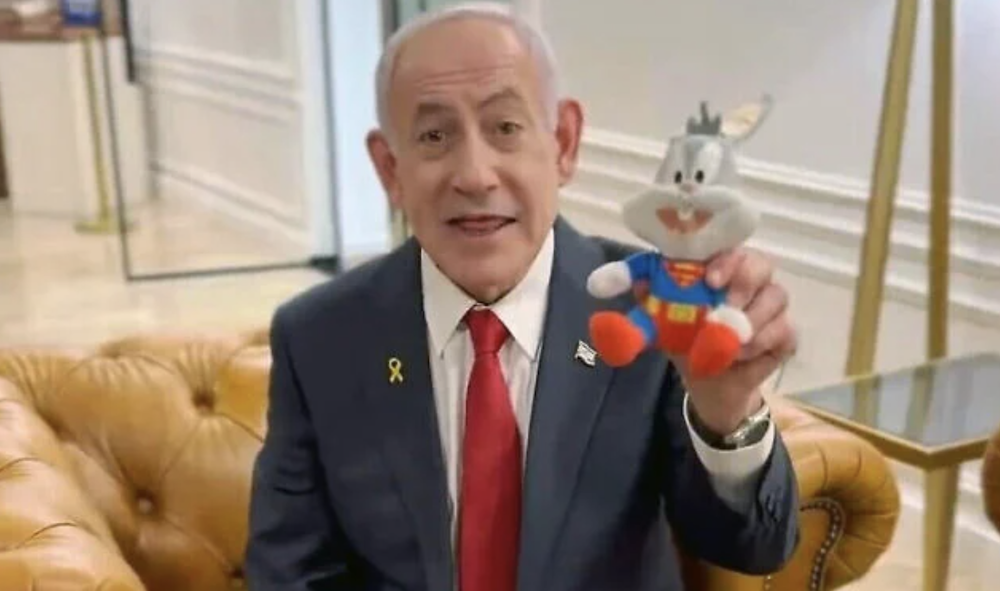 Prime Minister Benjamin Netanyahu holds up a Bugs Bunny doll in a video decrying his ongoing trial. (X/Screenshot)