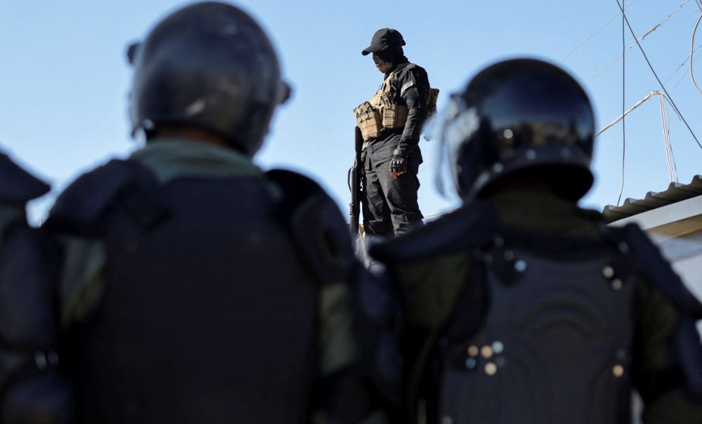 Syrian government forces stand guard at Al-Hol camp following the SDF’s withdrawal, Hasaka, Syria, Jan. 21, 2026. (Reuters)