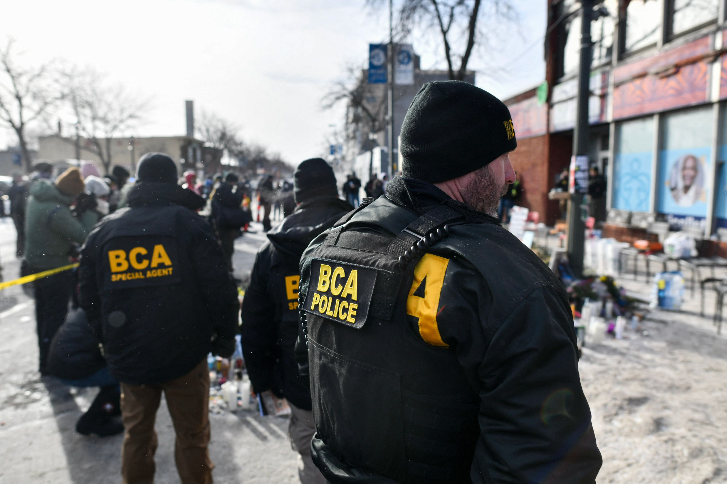 BCA officers near a makeshift memorial in the area where Alex Pretti was shot dead in Minneapolis, Minnesota. (AFP)