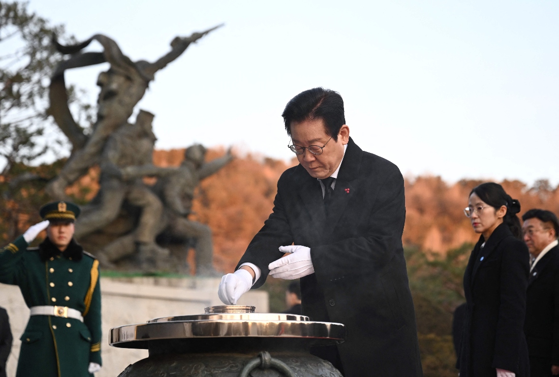 South Korean President Lee Jae Myung burns incense as he visits the National Cemetery with his cabinet members in Seoul at the beginning of the new year in S Korea. (AFP)