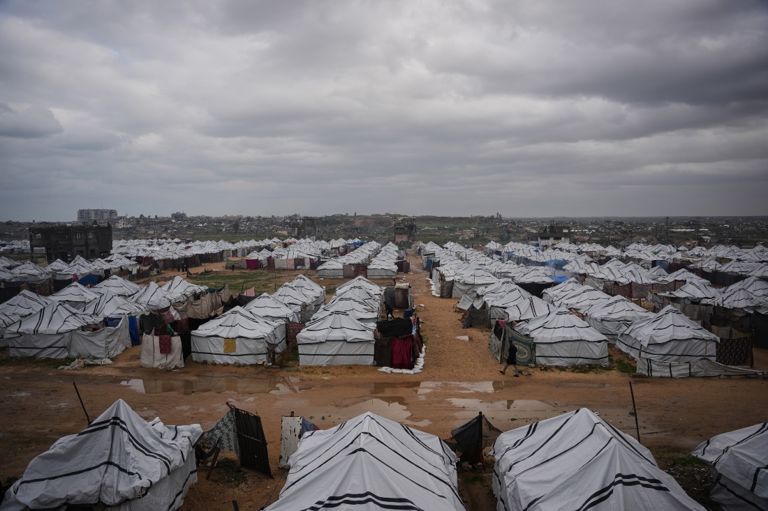 A makeshift tent camp for displaced Palestinians stretches across Nuseirat, central Gaza Strip. (AP)