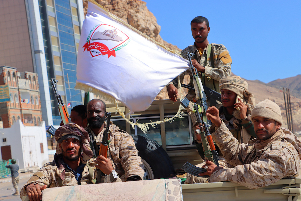 Government soldiers ride on the back of a pick-up truck in the Arabian Sea port city of Mukalla, as the internationally recognized government said it had retaken control of the key eastern port and capital of Hadramout province. (Reuters)