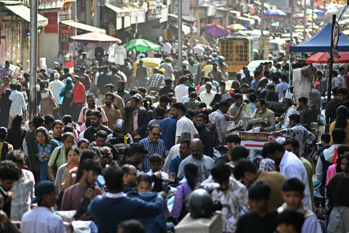People gather to shop for clothes at a weekend market in Bengaluru, India, on Dec. 28, 2025. (AFP)