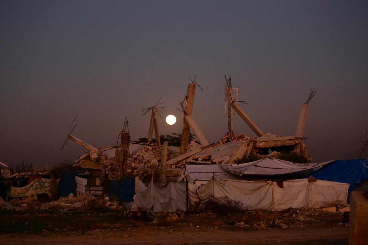 The first supermoon of the year, the ‘Wolf Moon,’ is seen rising over Bureij refugee camp, in the central Gaza Strip, Jan. 3, 2026. (AFP)