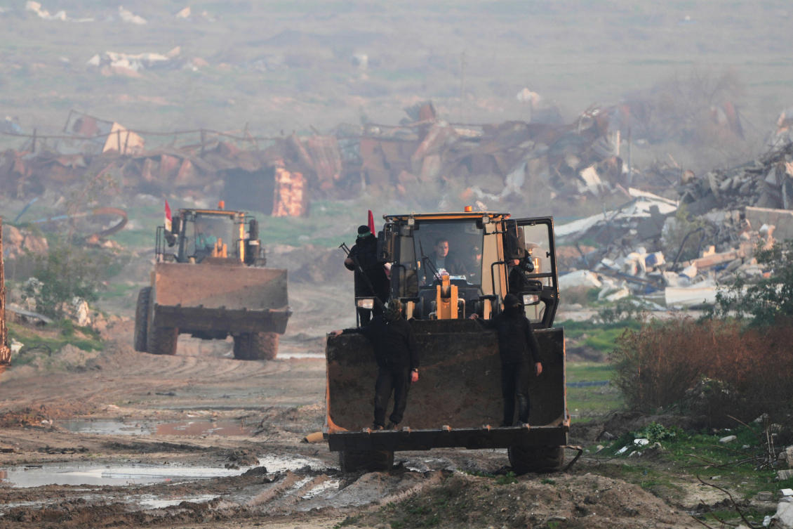 Hamas militants search for the remains of an Israeli hostage in the Zeitoun neighborhood of Gaza City, Jan. 7, 2026. (AP)