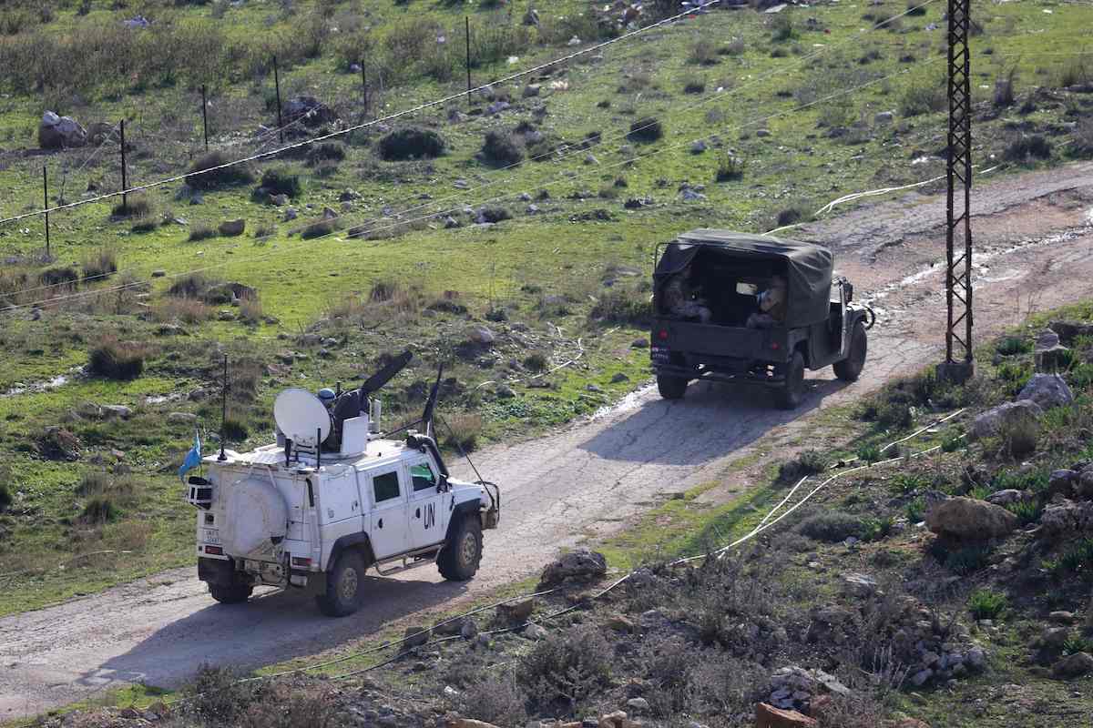 UN peacekeepers patrol in vehicles together with Lebanese soldiers near the border with Israel in southern Lebanon on Thursday. (AFP)