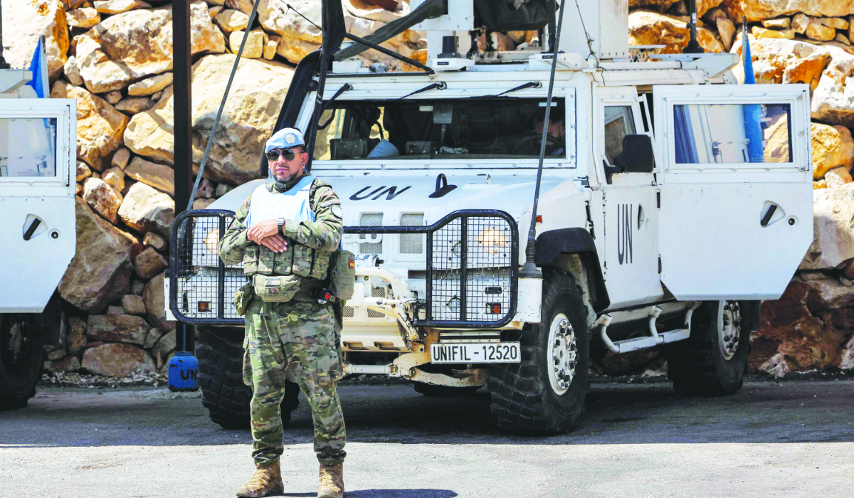 A peacekeeper of the Spanish Contingent stands at the United Nations Interim Force in Lebanon (UNIFIL) barracks near Khiam in southern Lebanon on August 23, 2024. (AFP)