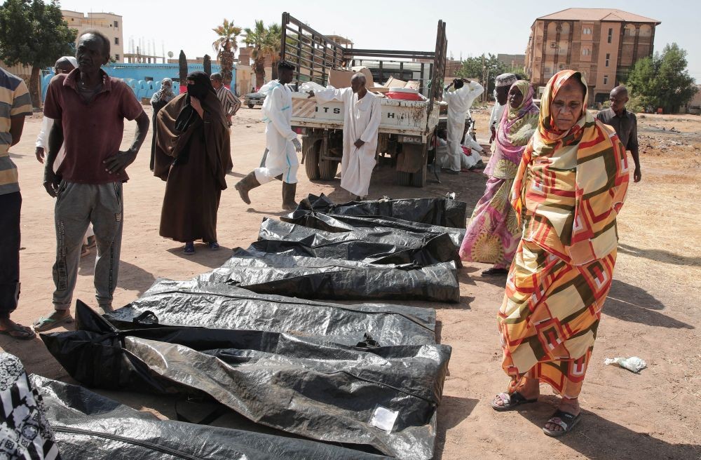 Relatives check the body bags of victims of Sudan’s conflict after the Sudanese Red Crescent transferred the remains from makeshift graves to a cemetery in Khartoum, Jan. 11, 2026. (AP Photo)