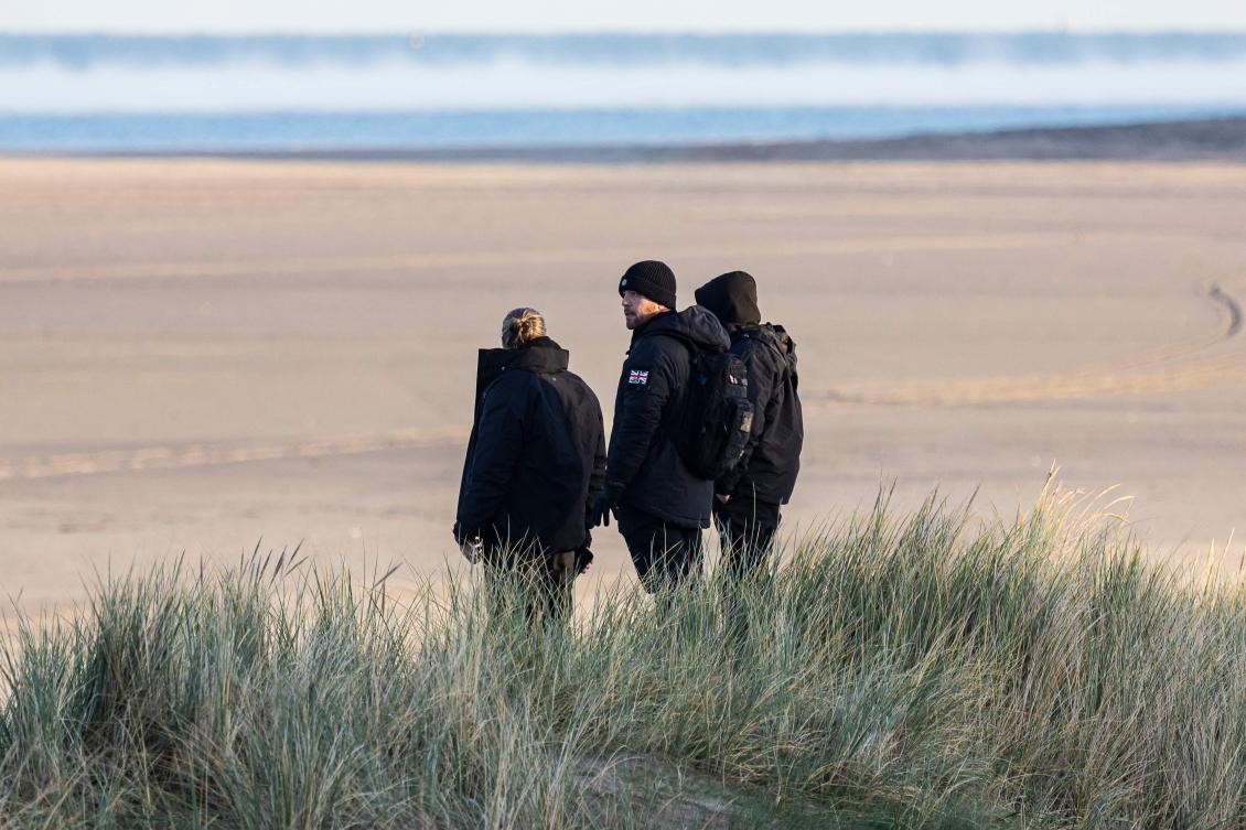 British far-right activists monitor the beach of Gravelines as they try to prevent migrants from crossing the English Channel, in northern France, on December 5, 2025. (AFP)