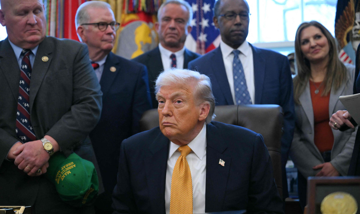 US President Donald Trump looks on before signing a bill in the Oval Office of the White House in Washington, DC, on January 14, 2026. (AFP)