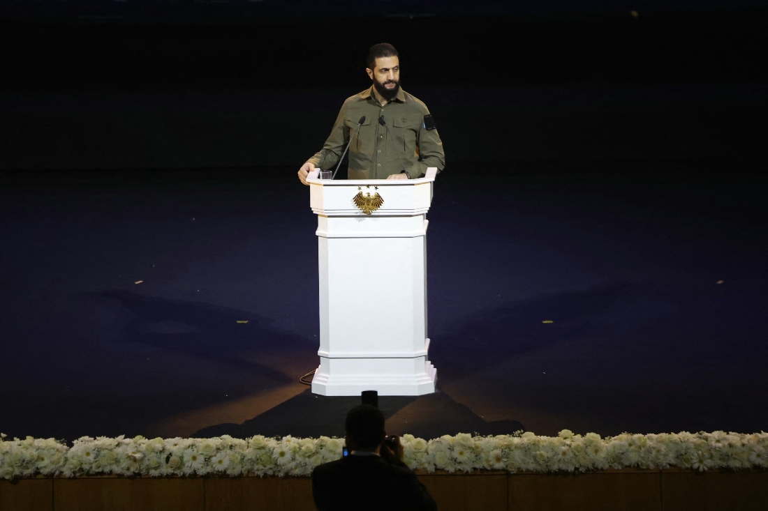Syrian President Ahmed al-Sharaa delivers a speech during a ceremony at the Convention Center as Syrians celebrate the first anniverasy of the fall of the Assad regime, in the Syrian capital Damascus. (AFP)