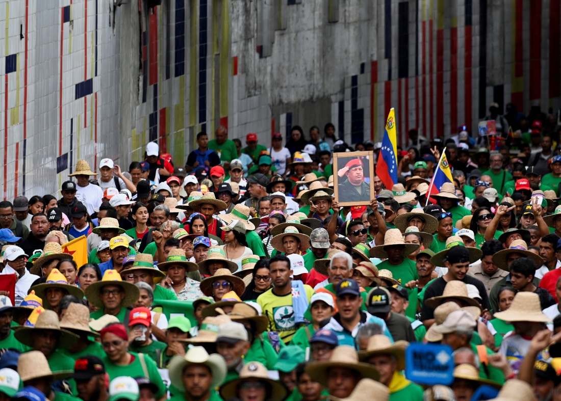 Demonstrators march to demand the release of ousted President Nicolas Maduro and his wife Cilia Flores in Caracas, Venezuela. (AFP)