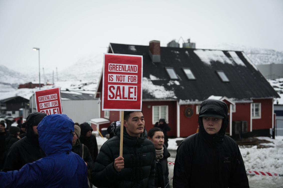 Young people with placards reading “Greenland is not for sale!” take part in a demonstration that gathered almost a third of the city population to protest against the US President’s plans to take Greenland, on Jan. 17, 2026 in Nuuk, Greenland, near the US Consulate to Greenland. (AFP)