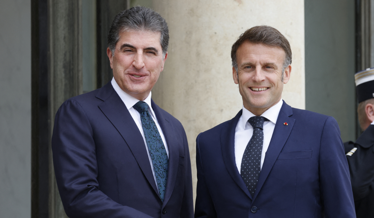 French President Emmanuel Macron (R) welcomes President of Iraq's autonomous Kurdistan Region Nechirvan Barzani for a working lunch at the Elysee Palace in Paris, on April 14, 2025. (AFP)