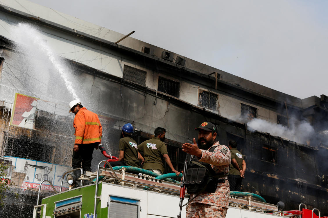 Death toll in Karachi shopping plaza fire rises to 23 as search continues for dozens missing