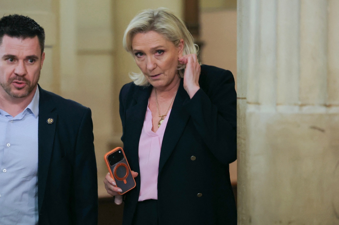 President of the parliamentary group of the French far-right Rassemblement National (RN) party, Marine Le Pen leaves the courtroom on the first day of a hearing in her appeal trial on suspicion of embezzlement of European public funds, at Paris courthouse. (AFP)