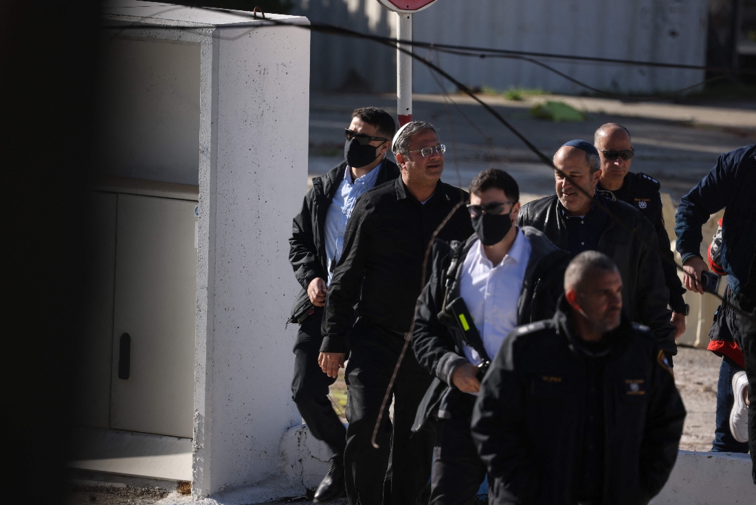 Far-right National Security Minister Itamar Ben Gvir walks alongside security forces as demolition work takes place inside the headquarters of the United Nations Relief and Works Agency (UNRWA) in the Sheikh Jarrah neighbourhood of Israeli-annexed east Jerusalem. (AFP)