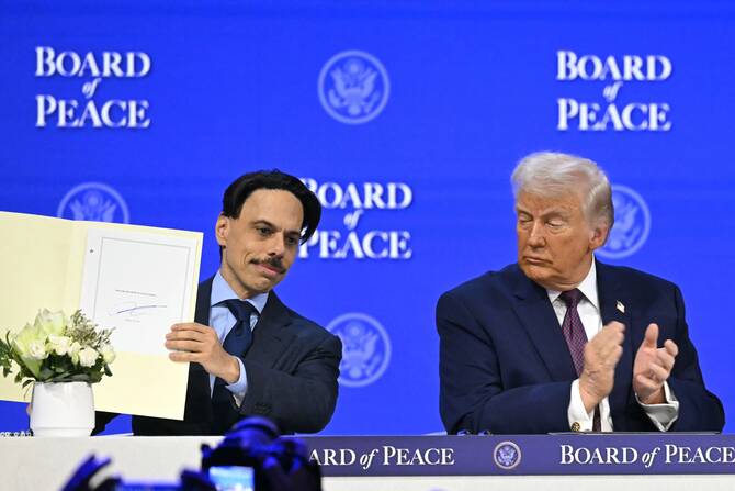 Saudi FM Prince Faisal with Trump at signing of the founding charter of Board of Peace at WEF in Davos. (AFP)