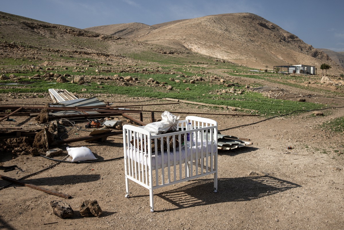 A cot is pictured as a Bedouin family packs their belongings and leaves their home after months of harassment from a nearby illegal Israeli settler outpost in Ras Ein al-Auja, near Jericho, Jan. 8, 2026. (AFP)