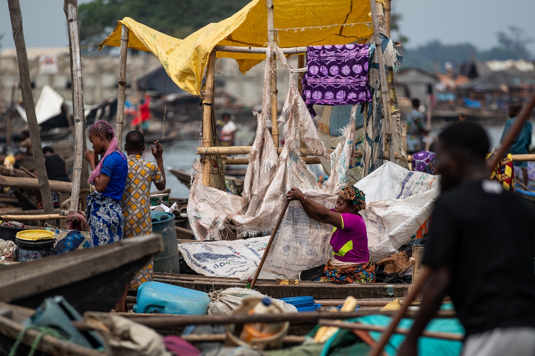 A woman prepares a makeshift structure during the demolition of houses in Makoko, a floating slum in Lagos, Nigeria. (AFP)
