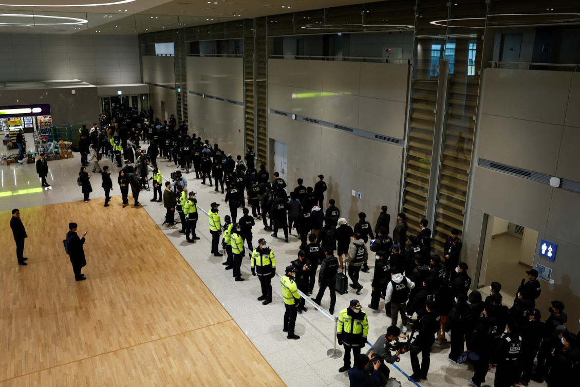 Police officers escort South Koreans allegedly involved in scam operations in Cambodia at Incheon International Airport in Incheon on Jan. 23, 2026. South Korean officials said in October that about 1,000 South Koreans were estimated to be in scam centers in Cambodia. (Reuters)