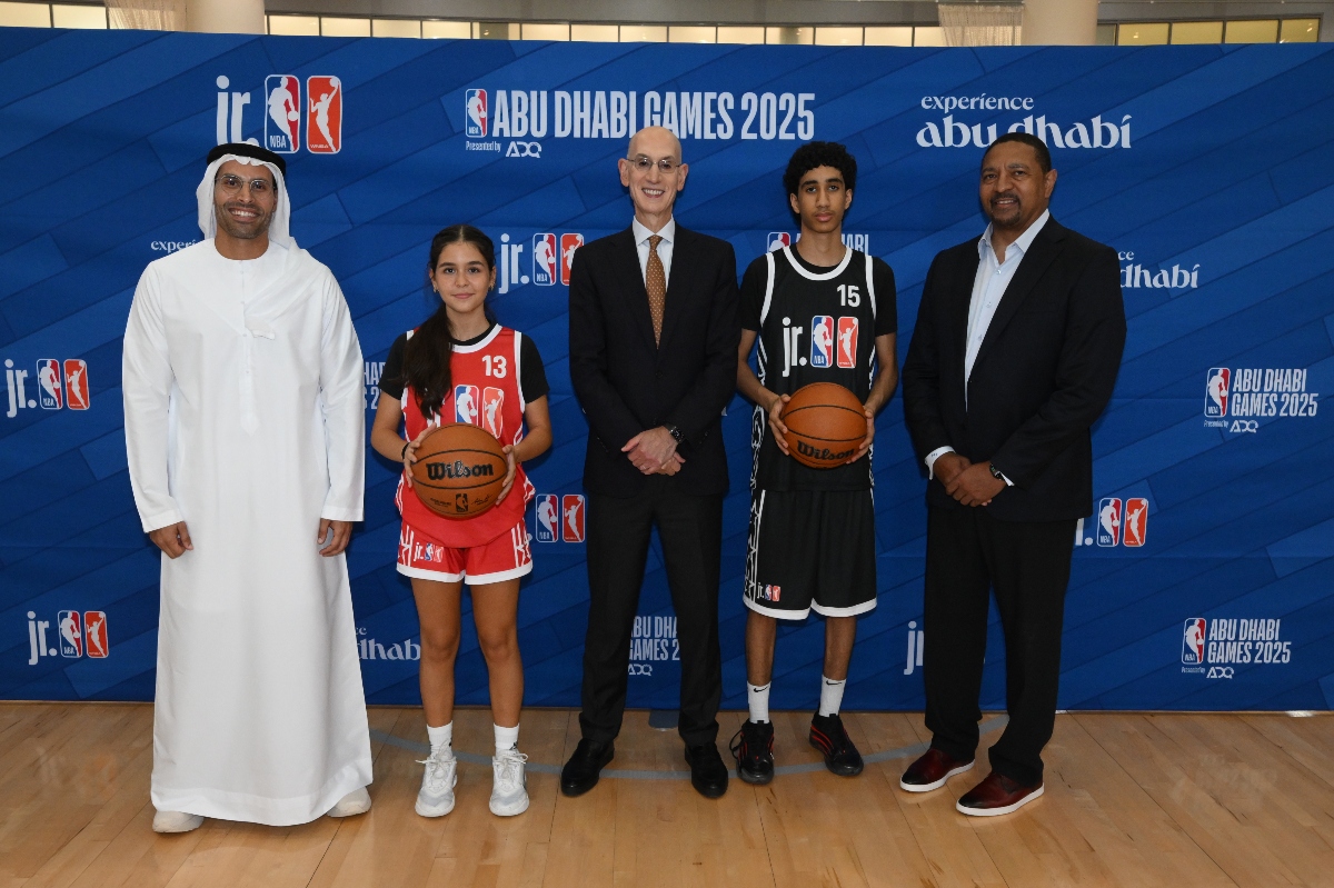 (Left to right) HE Mohamed Khalifa Al Mubarak, Chairman of DCT Abu Dhabi, NBA Commissioner Adam Silver and NBA Legend Mark Jackson alongside local participants at a youth basketball development event in Abu Dhabi as part of the largest Jr. NBA/Jr. WNBA week to date. (NBAE/Getty)