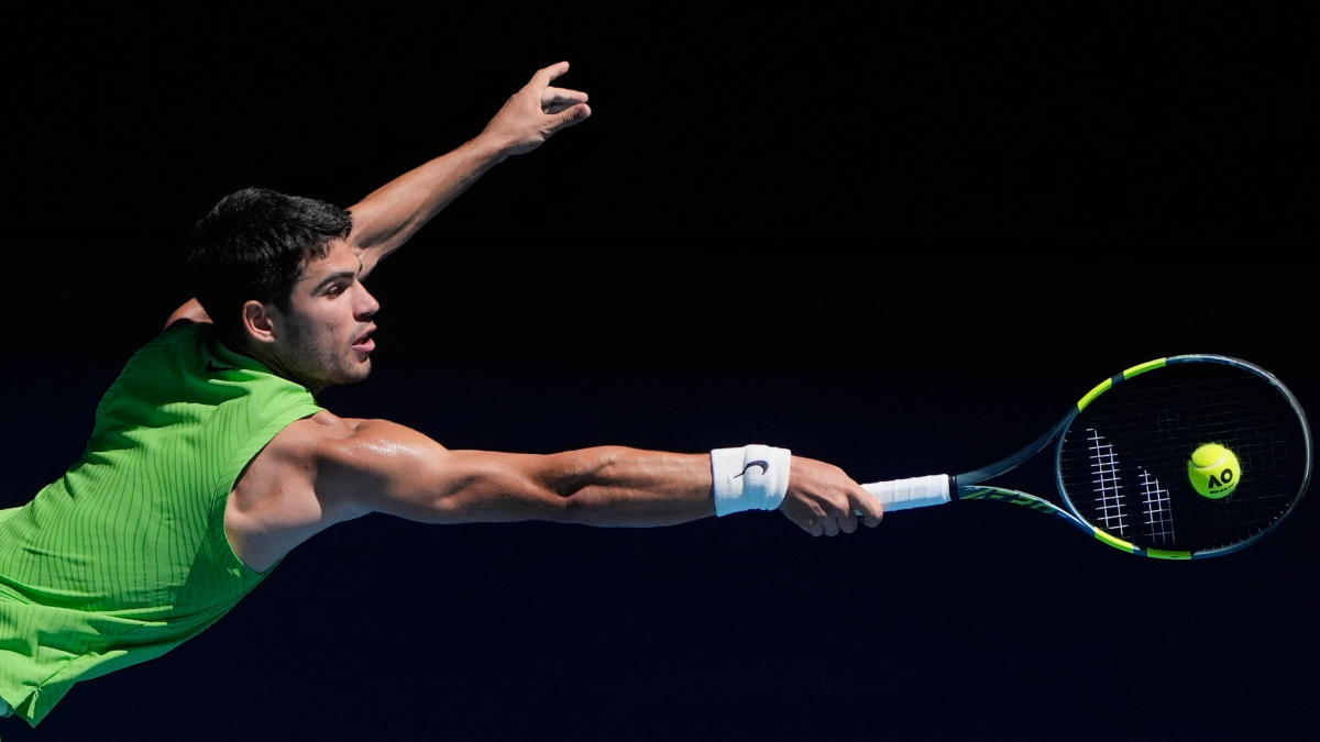 Carlos Alcaraz of Spain plays a backhand return to Corentin Moutet of France during their third round match at the Australian Open tennis championship in Melbourne, Jan. 23, 2026. (AP)