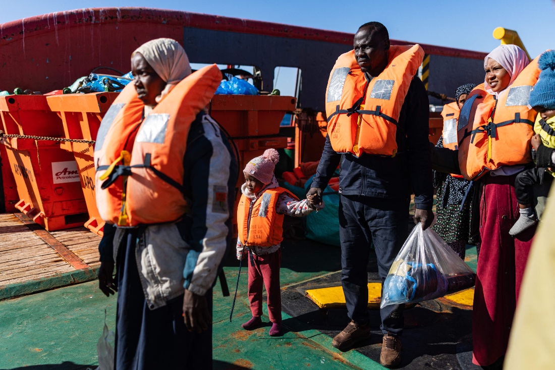 Migrants prepare to board a RHIB (Rigid inflatable boat) as crew members of the “Ocean Viking” rescue ship evacuate them from the oil tanker the 'Maridive 703' in the search-and-rescue zone of the international waters between Malta and Tunisia. (AFP)