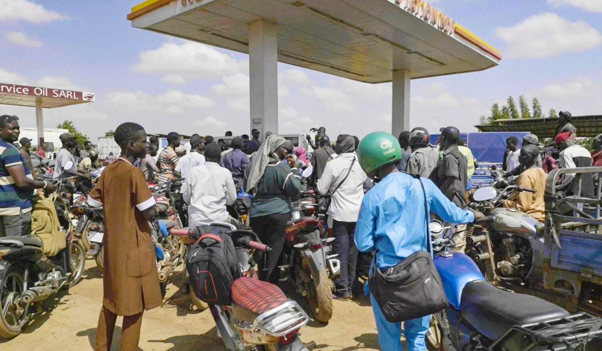 People queue with their motorcycles at a gas station amid a fuel shortage in Bamako, Mali, Tuesday, Oct 7, 2025 (AP)