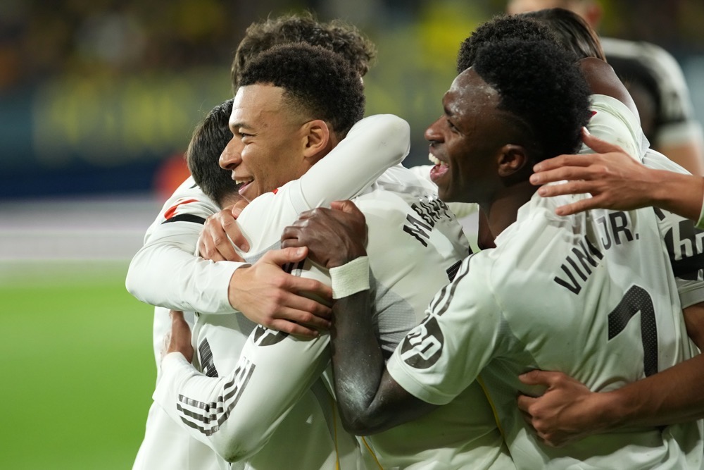 Real Madrid's Kylian Mbappe, left, celebrates with teammates. (AP)