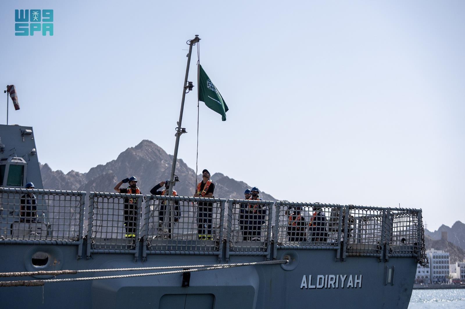 Forces salute the Saudi national flag aboard the HMS Al-Diriyah during naval exercises in the Gulf of Oman. (SPA)