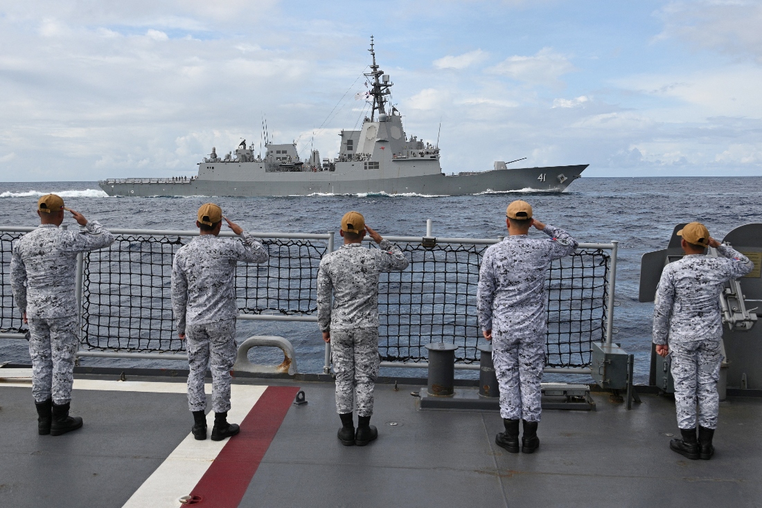 Sailors aboard the Philippine Navy frigate BRP Jose Rizal salute during near Scarborough Shoal in disputed waters of the South China Sea. (AFP) a passing exercise