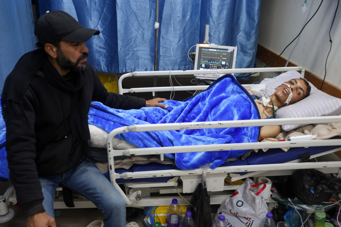 Injured Palestinian Ahmed Rasras lies on a hospital bed while waiting for the Rafah Crossing to open to seek treatment abroad, at Nasser Hospital, in Khan Younis, in the southern Gaza Strip. (Reuters)