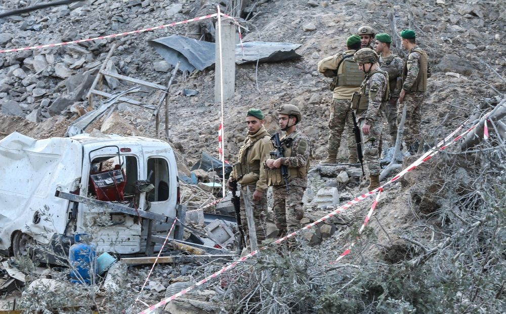 Lebanese soldiers inspect the scene following an Israeli airstrike that targeted a building in the southern Lebanese village of Kfar Dounine, Jan. 25, 2026. (AFP)