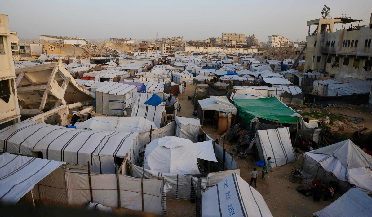 A general view of tents that houses Palestinians situated next to destroyed buildings by the Israeli military in Khan Yunis in the southern Gaza Strip on January 27, 2026. (AFP)
