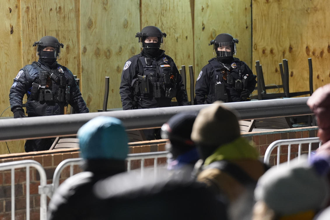Police stand during a noise demonstration outside the Graduate by Hilton Minneapolis hotel on Wednesday, Jan. 28, 2026, in Minneapolis. (AP)
