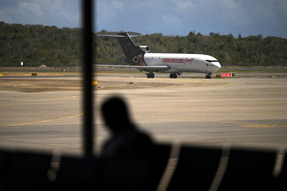 A cargo plane is seen on the runway at the Simon Bolivar International Airport in Maiquetia, La Guaira State, Venezuela, Nov. 30, 2025. (AFP)