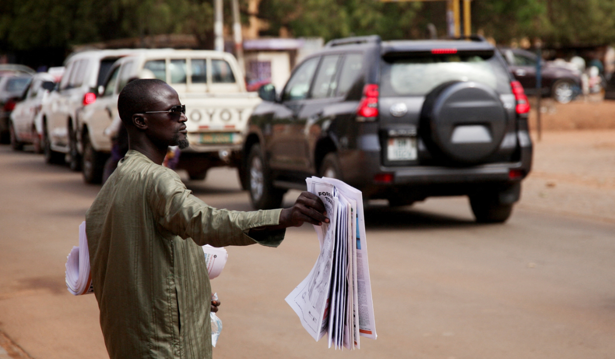 A man sells newspapers in a street, following an attack on the international airport in Niamey, Niger January 30, 2026. (REUTERS)