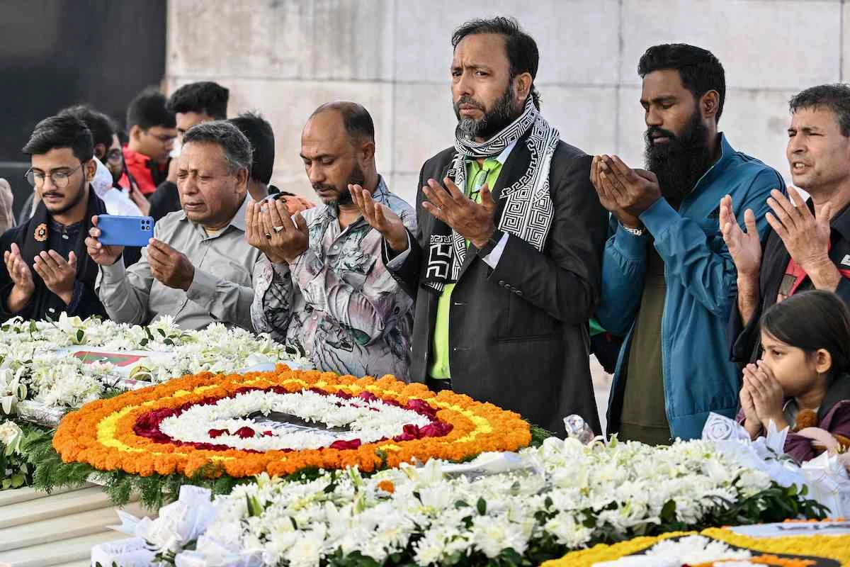Supporters of the Bangladesh Nationalist Party and mourners pray at the grave of former prime minister Khaleda Zia in Dhaka on January 1, 2026. (AFP)
