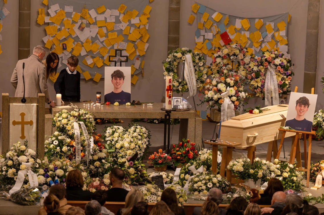 Mother Laetitia Brodard-Sitre, father Christophe Brodard and brother Benjamin Brodard of Arthur Brodard, a victim of the fire that broke out during a New Year’s Eve party at a bar in the ski resort of Crans-Montana, attend his funeral at Temple de Lutry in southwestern Switzerland, Jan. 8, 2026. (Reuters)