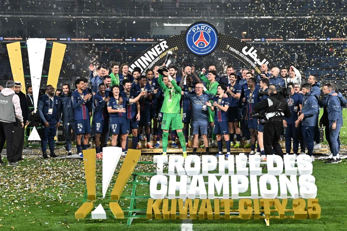 PSG’s players celebrate with the trophy after winning the French Champions’ Trophy (Trophee des Champions) match against Olympique de Marseille at the Jaber Al-Ahmad International Stadium in Kuwait City on Jan. 8, 2026. (AFP)