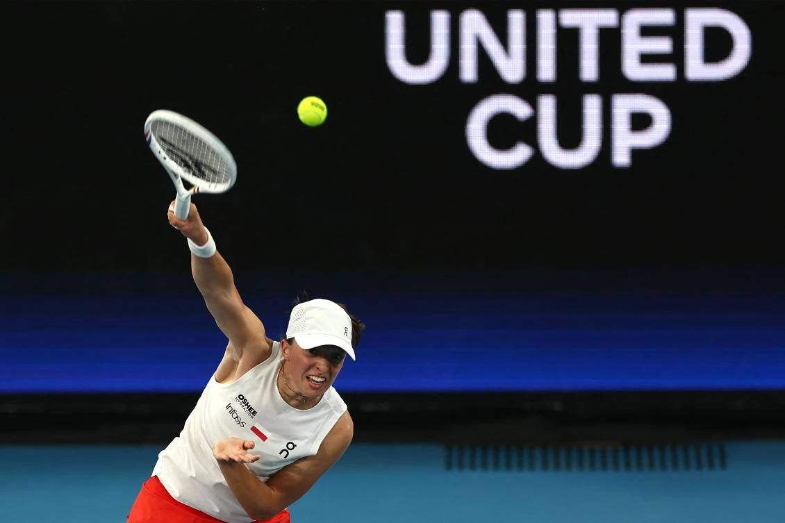 Poland’s Iga Swiatek serves to Australia’s Maya Joint during their women’s singles quarter-final match at the United Cup at Ken Rosewall Arena in Sydney on Jan. 9, 2026. (AFP)