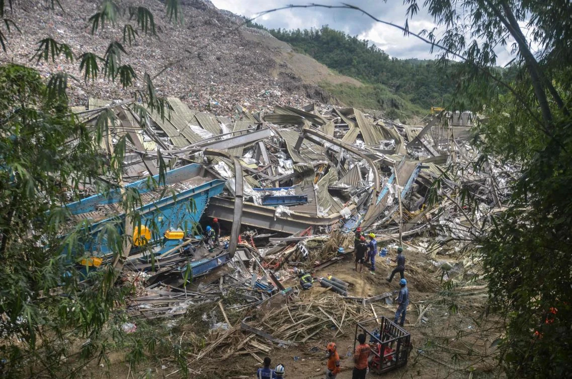 Filipino rescuers detect ‘signs of life’ in garbage avalanche that killed 4 and left dozens missing