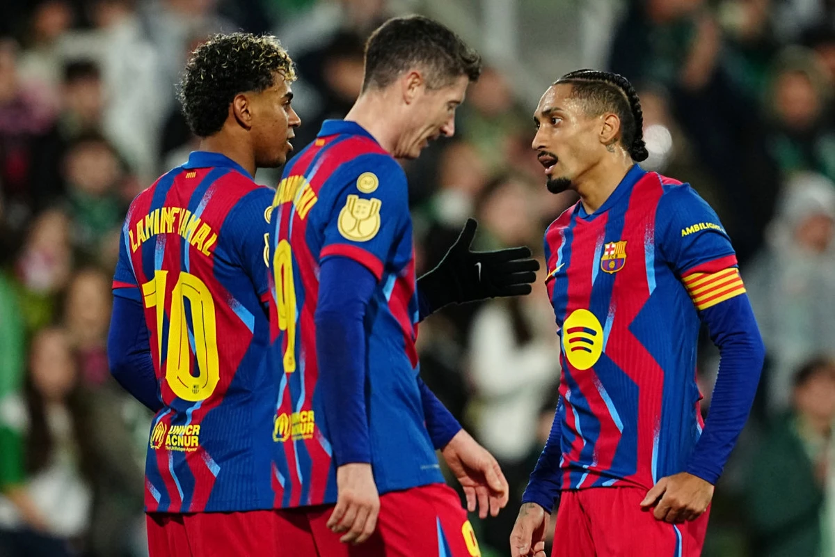 Barcelona's Lamine Yamal, left, celebrates after scoring his side's second goal with his teammate Barcelona's Raphinha during the Copa del Rey round of 16 soccer match between Racing Santander and Barcelona, in Santander, Spain, Thursday, Jan. 15, 2026. (AP)