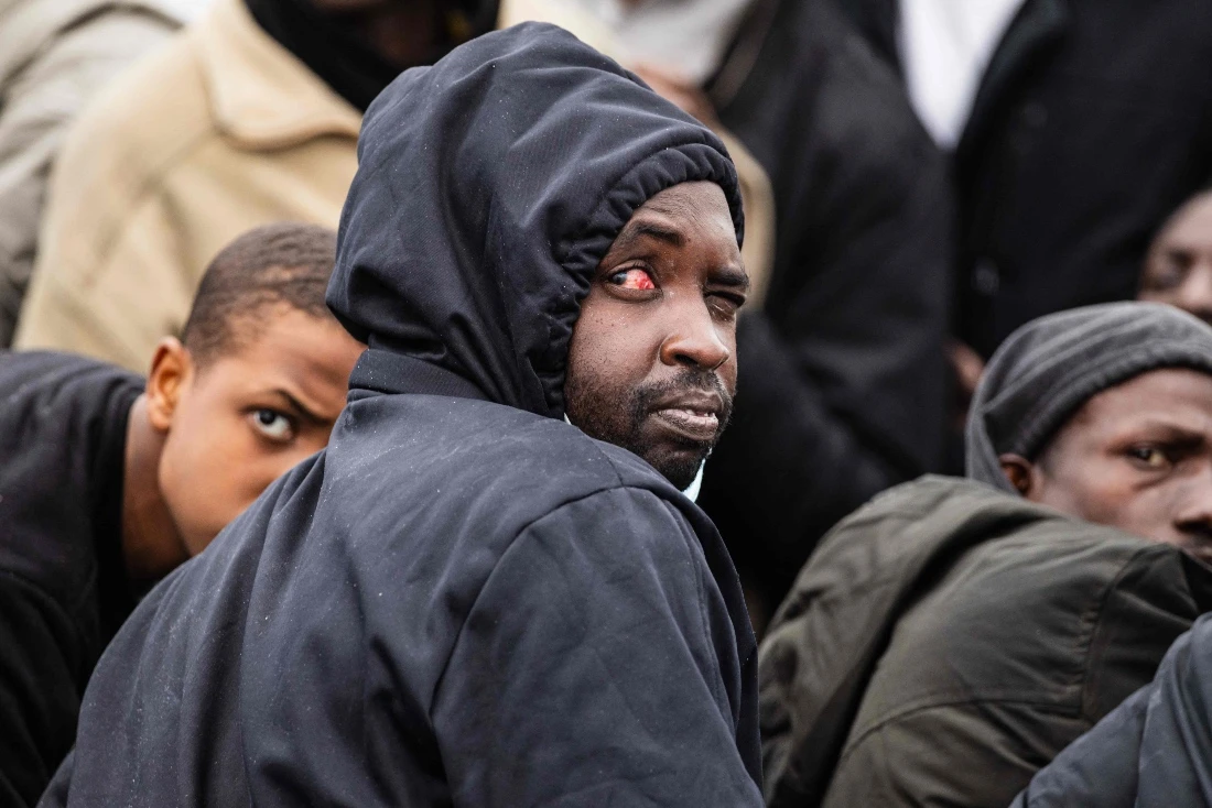 A migrant onboard a rubber boat looks on as they wait to be rescued by crew members of the “Ocean Viking” rescue ship during a rescue operation in the search-and-rescue zone off the international waters of Libya. (AFP)