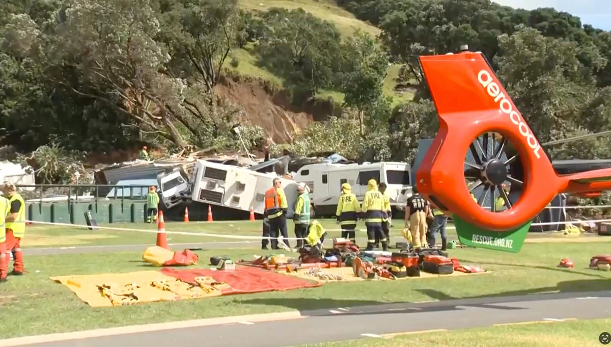 Emergency services were called to the slide at the base of Mount Maunganui, above, on New Zealand’s North Island after 9:30 a.m. (TVNZ via AP)
