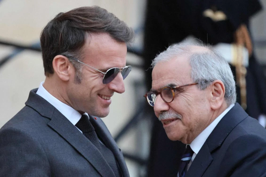 France’s President Emmanuel Macron shakes hands with Lebanon’s PM Nawaf Salam prior to their meeting at the Elysee presidential palace in Paris, on Jan. 23, 2026. (AFP)
