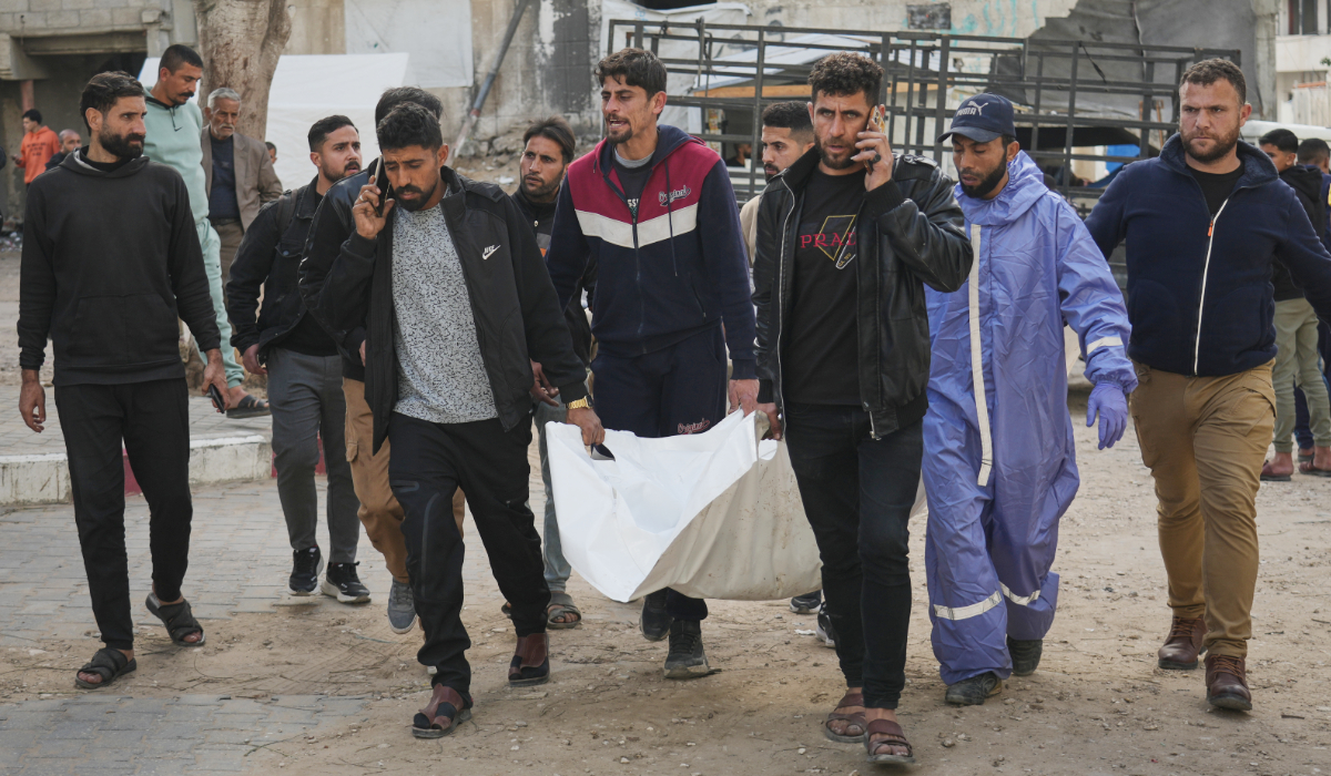 The bodies of Palestinians killed in an Israeli army strike on a police station are brought to Shifa Hospital in Gaza City Saturday, Jan. 31, 2026. (AP)